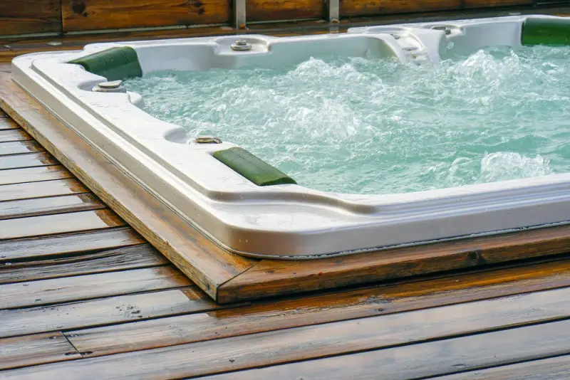 hot tub on wood flooring